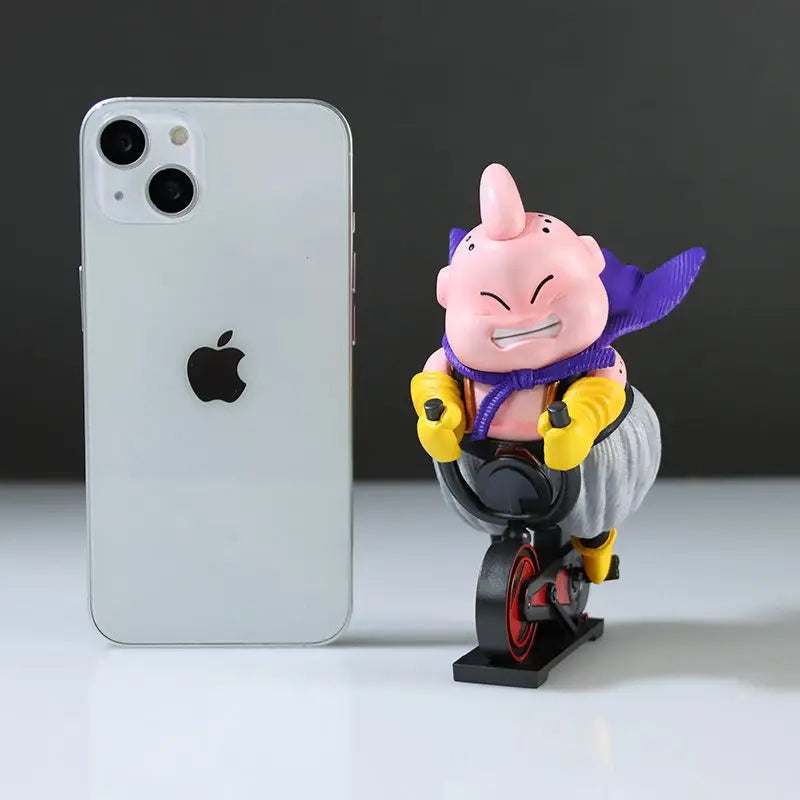 Majin Buu na bicicleta, ao lado de um celular